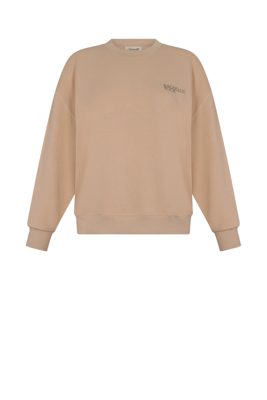 Polera Kyle  oversize de algodón beige frase "Bachelorette Tour" Clubmatte vista frontal